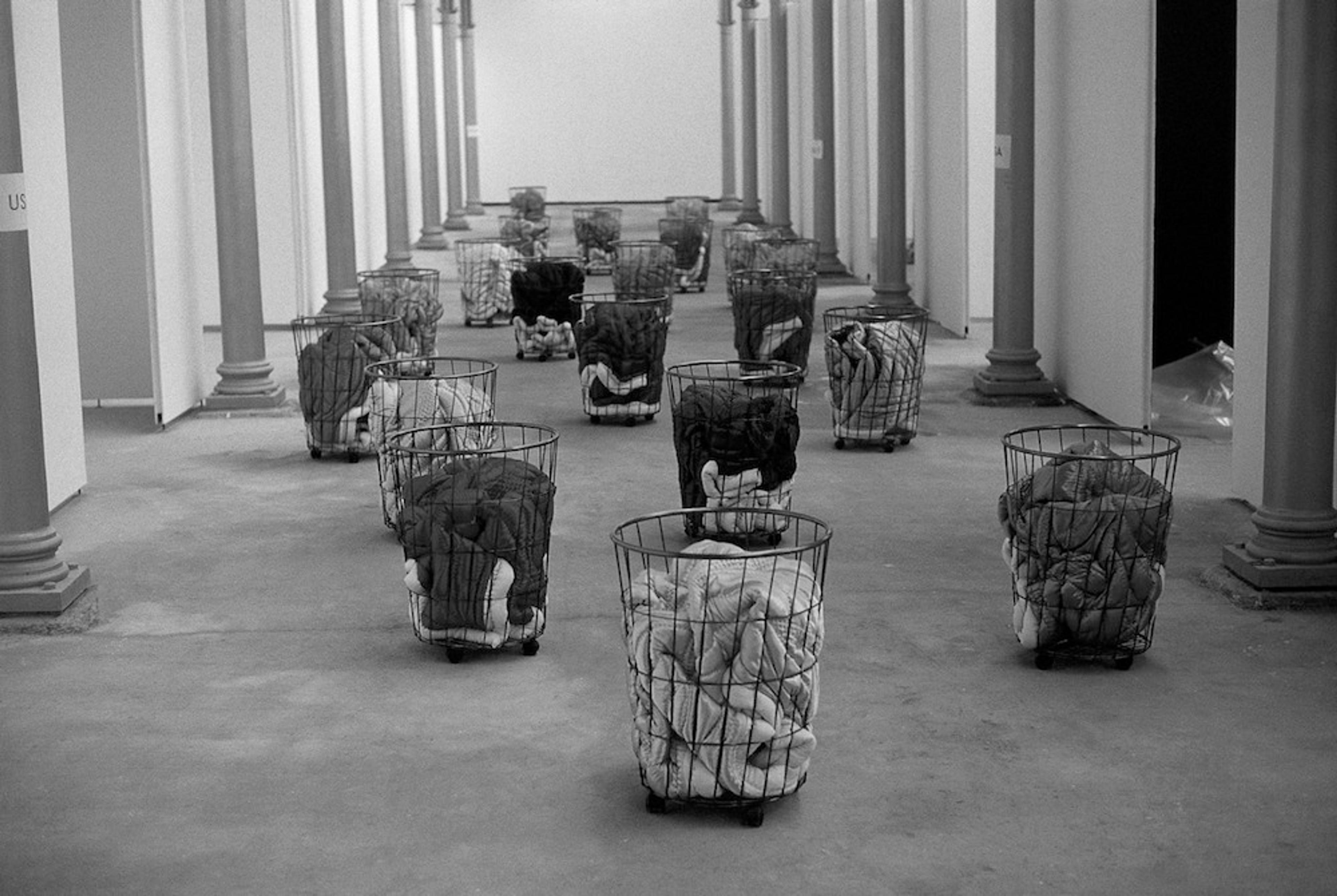 Fig. 1. Gülsün Karamustafa, Mystic Transport (1992), mixed media, 20 pieces, each 23 5/8" x 17 ¾" x 35 ½". Third International Istanbul Biennial, Feshane, Istanbul.