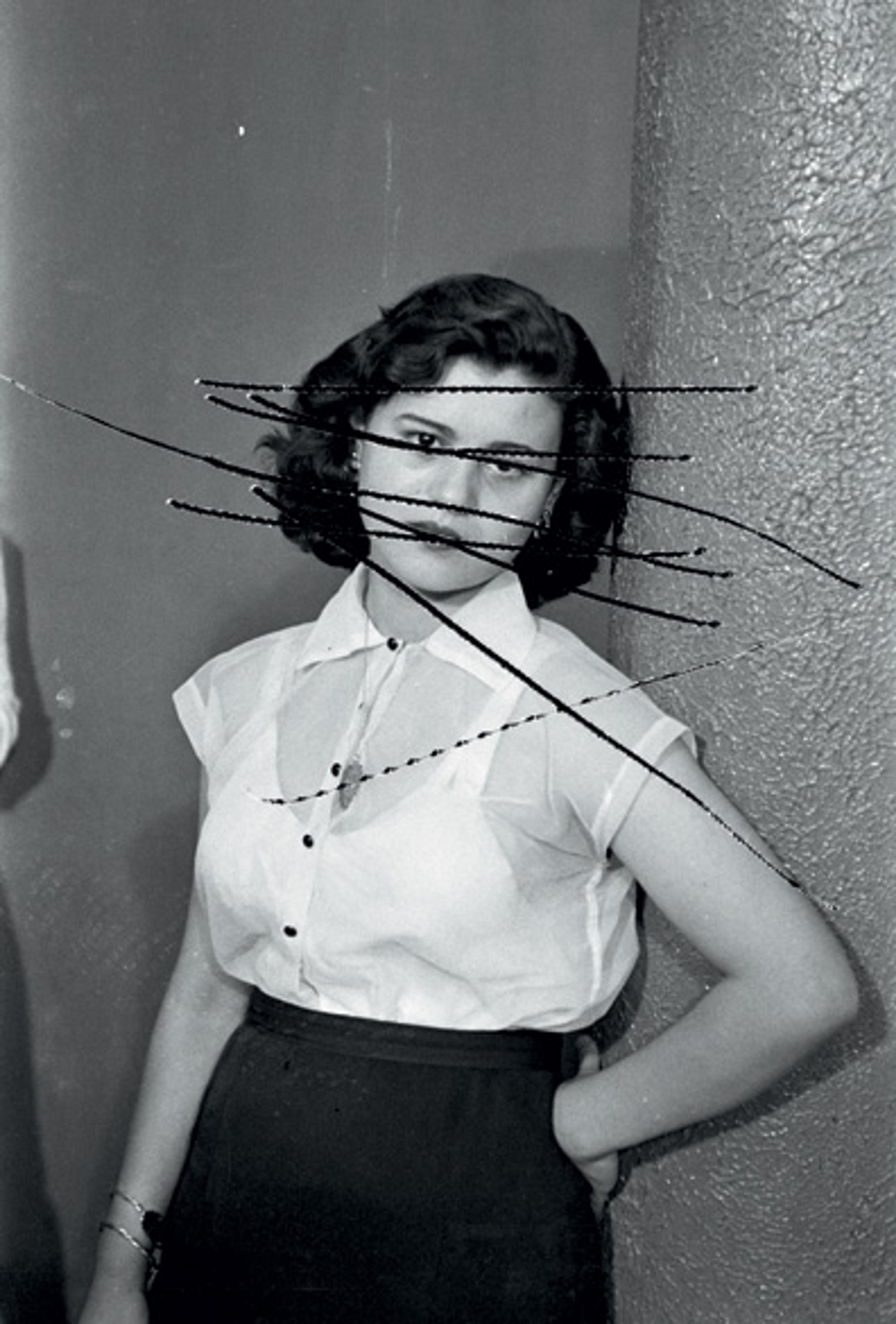 From A. Zaatari's Objects of Study . 2006 A print of a scratched negative showing a portrait of Mrs. Baqari. Photo by Hashem el Madani, 1959 © Zaatari / AIF