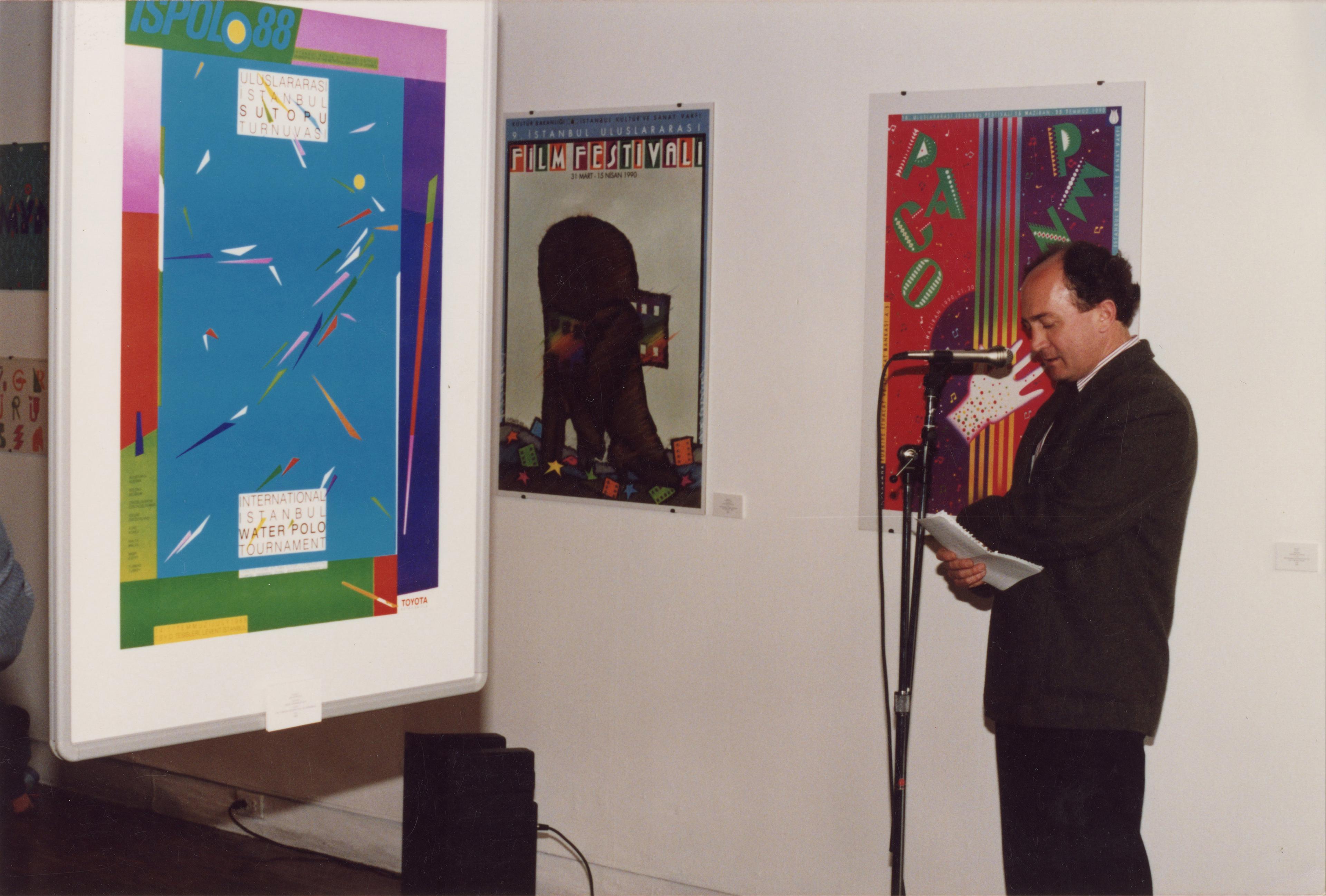 Sadık Karamustafa delivering the opening remarks at the exhibition Posters from Turkey , York Quay Gallery, Toronto, May 1992 Salt Research, Sadık Karamustafa Archive